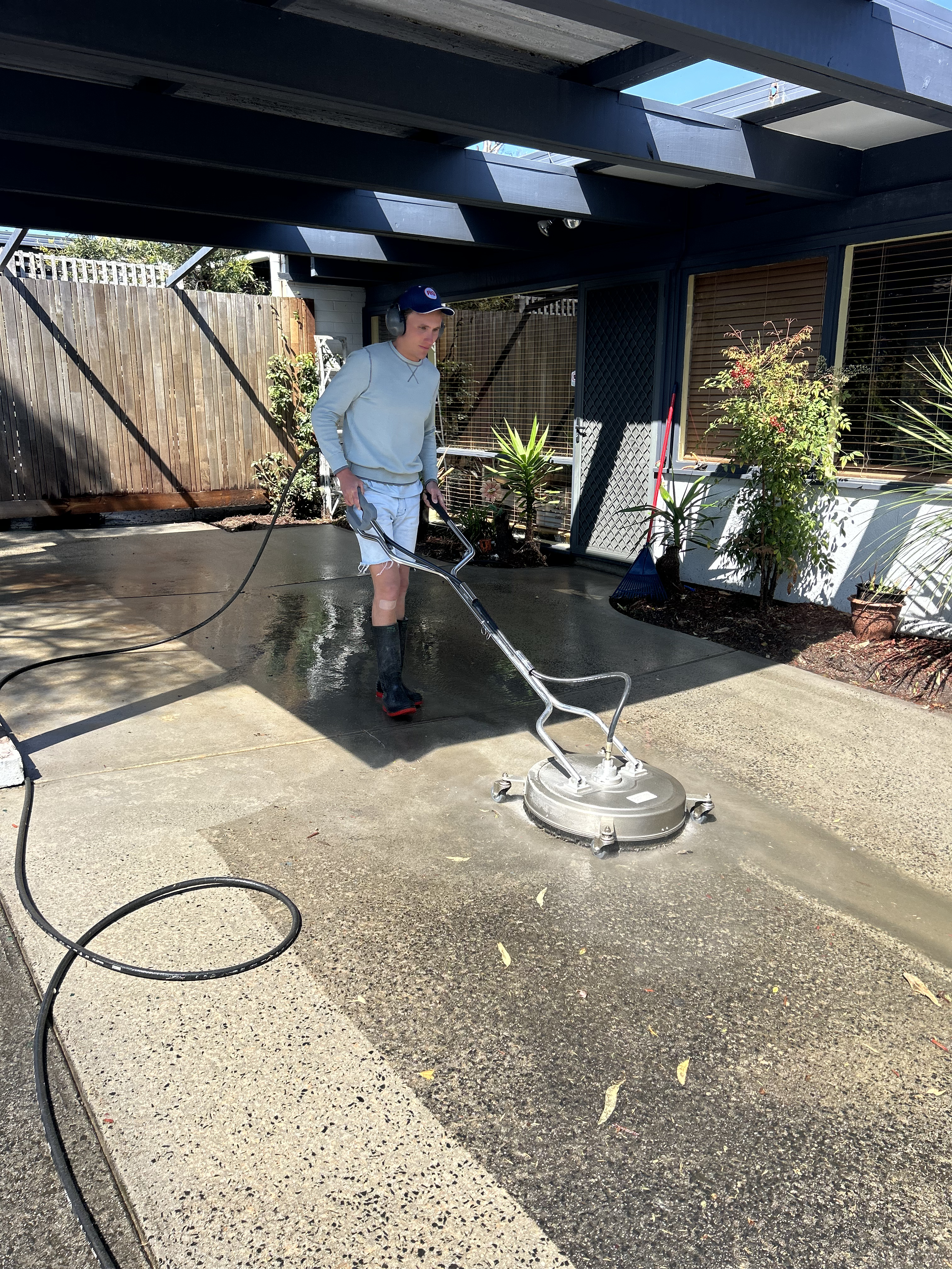 Pressure cleaning outdoor surface